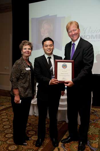 Sam Han presenting a certificate of Recognition to Alzheimer's Association.