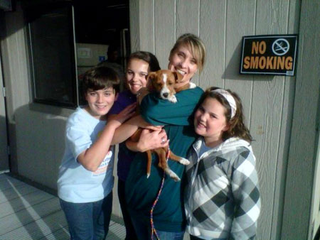 Supervisor Nelson's family with an adopted pet.