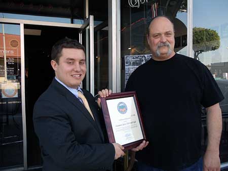 Nick Constantino presents award to Steamer's employee Steve Ambrose.