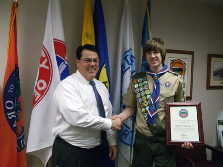 Supervisor Nelson presents a Certificate of Recognition to Theodore Rasmussen IV.