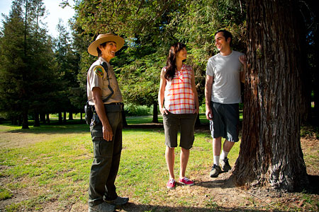 Park Range talking to couple walking in Carbon Canyon.