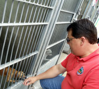 Supervisor Nelson visiting a puppy.