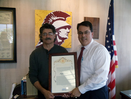 Supervisor Nelson presenting a Certificate of Recognition to Angelo Torres.